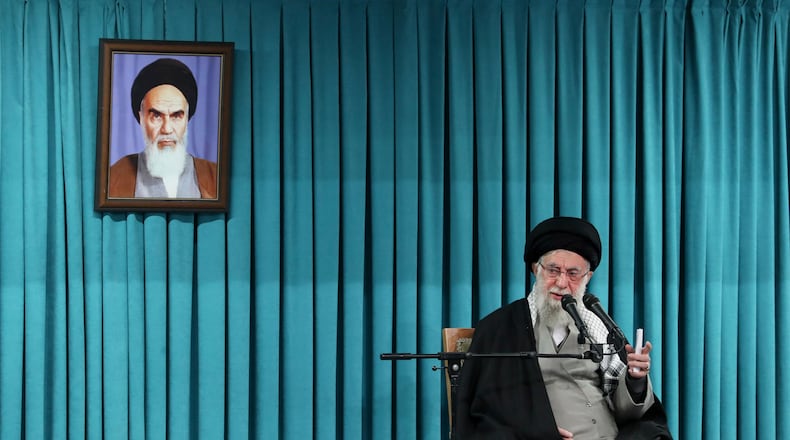 FILE - In this photo released by the official website of the office of the Iranian supreme leader, Supreme Leader Ayatollah Ali Khamenei speaks under a portrait of the late revolutionary founder Ayatollah Khomeini, in a ceremony meeting a group of officials, in Tehran, Iran, March 8, 2025. (Office of the Iranian Supreme Leader via AP, File)