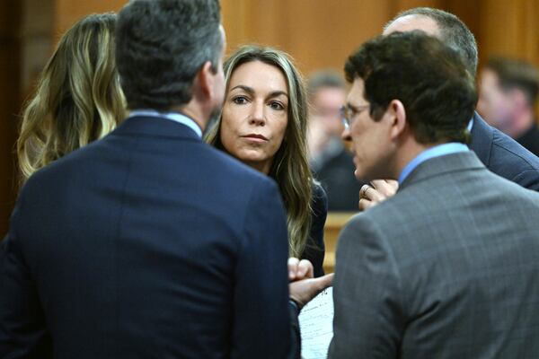 Karen Read, center, speaks with defense team during her trial, Friday, April 25, 2025, at Norfolk Superior Court in Dedham, Mass. (Josh Reynolds /New York Post via AP, Pool)