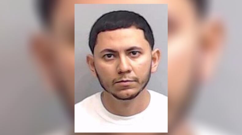 Jesus Alvarez De La Rosa was arrested Sunday in Calhoun. He has been charged with murder for his alleged role in a deadly home invasion in Sandy Springs.