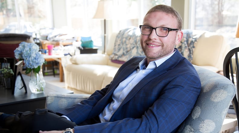 Josh Horton sits in his grandmother's Alpharetta home.