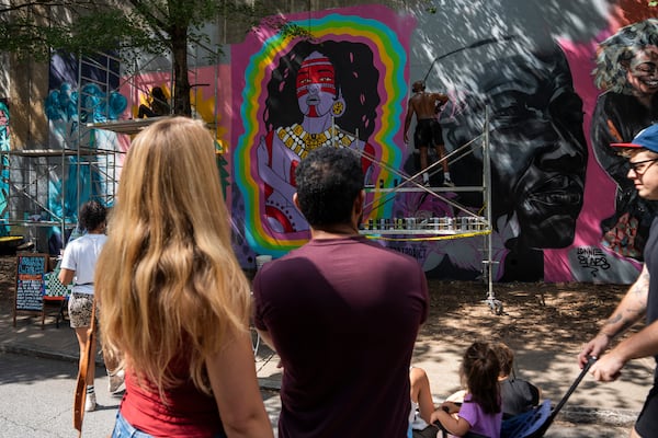 Local artists create murals live at the 11th annual Forward Warrior festival in the Cabbagetown neighborhood of Atlanta on Saturday, Sept. 13, 2025. (Olivia Bowdoin for the AJC)
