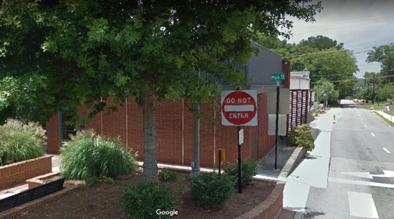 The Johnston Building, at Main and Mill streets in downtown Woodstock, is to be replaced, and construction will close Wall Street behind the building for six months. GOOGLE MAPS