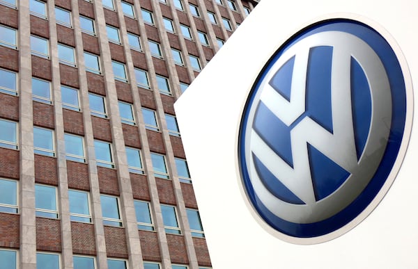FILE - In this April 13, 2018 file photo, Volkswagen logo is pictured in front of a company building in Wolfsburg, Germany. (AP Photo/Michael Sohn, File)
