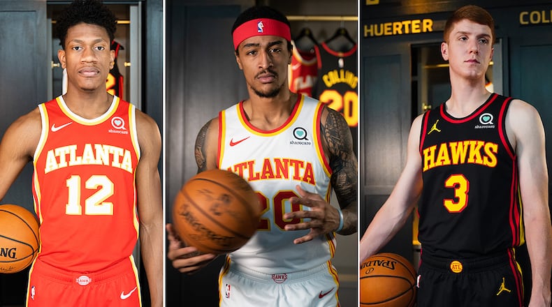 Hawks' De'Andre Hunter (from left), John Collins and Kevin Huerter model the new uniform styles that will make their debut in the 2020-21 NBA season.