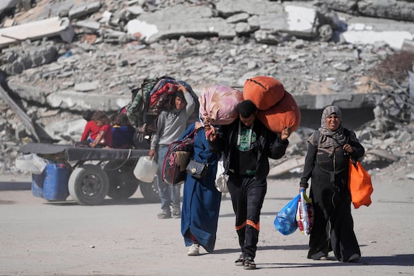 Displaced Palestinians fleeing Beit Lahia amid ongoing Israeli military operations in the Gaza Strip arrive in Jabalia, northern Gaza, on Friday, May 16, 2025. (AP Photo/Jehad Alshrafi)