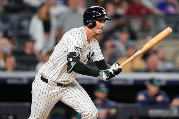 New York Yankees' Cody Bellinger hits a single during the ninth inning of a baseball game against the Seattle Mariners, Thursday, July 10, 2025, in New York. (AP Photo/Yuki Iwamura)