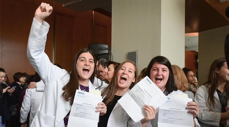 Lauren (left), Stephanie and Allison Boden, sisters and fourth-year students at Emory Medical School, celebrated the results of Match Day on March 16, when each discovered which residency program had accepted their applications. The sisters are fraternal triplets. CONTRIBUTED BY JACK KEARSE