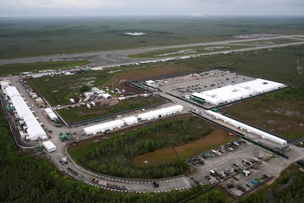 Work progressed on a new migrant detention facility dubbed "Alligator Alcatraz," at Dade-Collier Training and Transition facility in the Florida Everglades, Friday, July 4, 2025, in Ochopee, Fla. (AP Photo/Rebecca Blackwell)