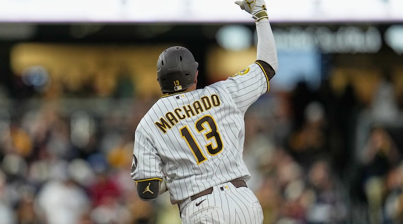 San Diego Padres' Manny Machado celebrates after hitting a home run during the fourth inning of a baseball game against the Atlanta Braves Monday, June 22, 2026, in San Diego. (AP Photo/Gregory Bull)