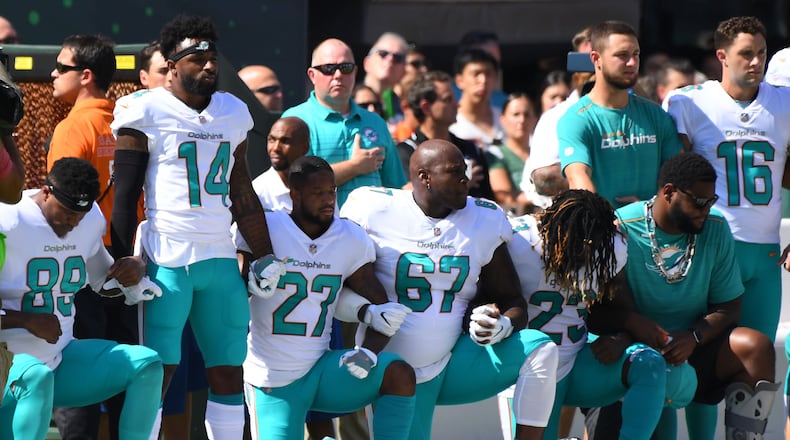 Some of the Miami Dolphins take a knee during the anthem prior to the game against the New York Jets last season.