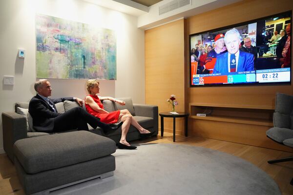 Canada's new Prime Minister and Liberal Leader Mark Carney and his wife Diana Fox Carney take in the results on election night in Ottawa, Ontario, Monday, April 28, 2025. (Sean Kilpatrick/The Canadian Press via AP)