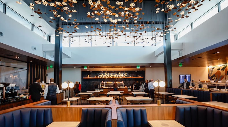 At the American Express Centurion Lounge at Hartsfield-Jackson International Airport, a large dining area has two buffets and tables for seating.
Miguel Martinez /miguel.martinezjimenez@ajc.com