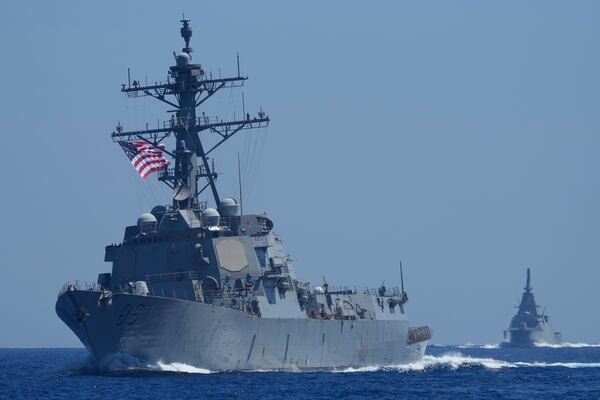 A US Navy USS Shoup (DDG86), left, and Japanese Maritime Self-Defence Force (JMSDF) frigate JS Noshiro. center, maneuver with Philippine Navy BRP Jose Rizal, not shown, during the Philippines United States Japan Multilateral Maritime Cooperative Activity off a disputed South China Sea shoal on Friday, March 28, 2025. (AP Photo/Aaron Favila)