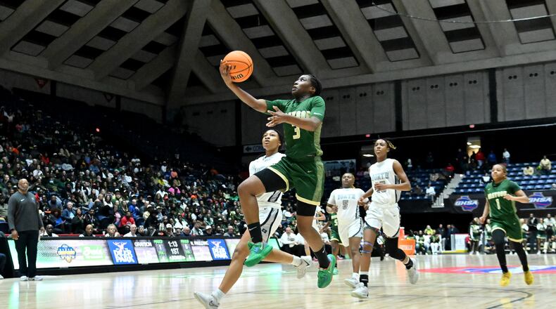 Grayson's Danielle Carnegie (3) goes to the basket for a shot during the first half of GHSA Basketball Class 7A Girl’s State Championship game at the Macon Centreplex, Saturday, Mar. 9, 2024, in Macon. (Hyosub Shin / Hyosub.Shin@ajc.com)