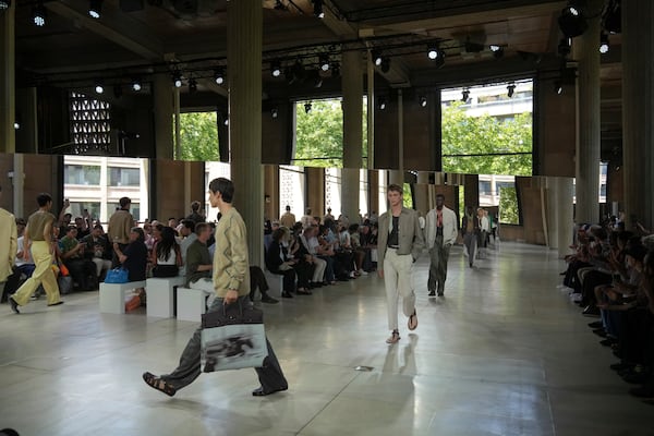 Models wear creations as part of the men's Hermes Spring-Summer 2026 collection, that was presented in Paris Saturday, June 28, 2025. (AP Photo/Michel Euler)
