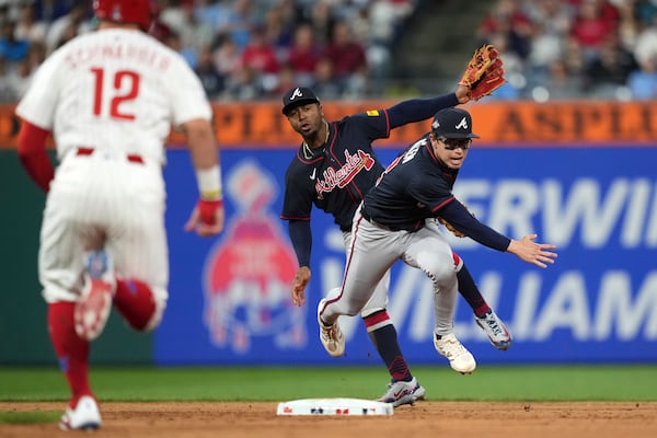 Braves shortstop Nick Allen (right) collides with second baseman Ozzie Albies while turning a double play in the sixth inning Tuesday.