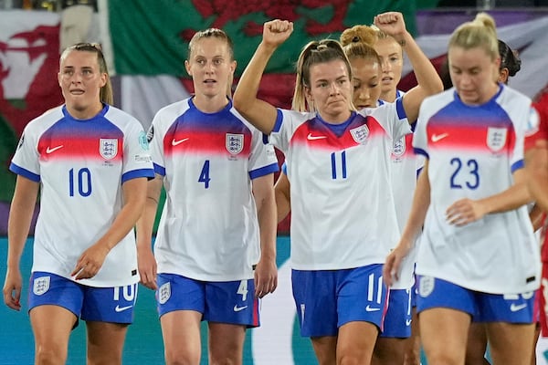 England's Lauren Hemp, center, celebrates with teammates after scoring her sides third goal during the Women's Euro 2025, group D, soccer match between England and Wales at Arena St. Gallen in St. Gallen, Switzerland, Sunday, July 13, 2025. (AP Photo/Martin Meissner)