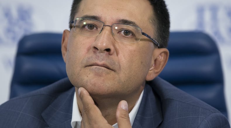 Valery Seleznev, a prominent Russian lawmaker and the father of Roman Seleznev who was charged with bank fraud and other crimes earlier this week in Atlanta listens to a question during a news conference in Moscow, Russia, Friday, July 11, 2014. (AP Photo/Alexander Zemlianichenko)