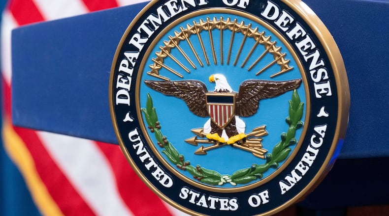 FILE - The Department of Defense seal is seen on the podium in the Press Briefing room at the Pentagon, Oct. 29, 2024, in Washington. (AP Photo/Kevin Wolf, File)