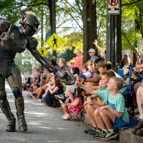Thousands line up along Peachtree Street for the 2024 Dragon Con parade in Atlanta. This year's parade takes place at 10 a.m. Saturday. (Ben Hendren for The Atlanta Journal-Constitution)