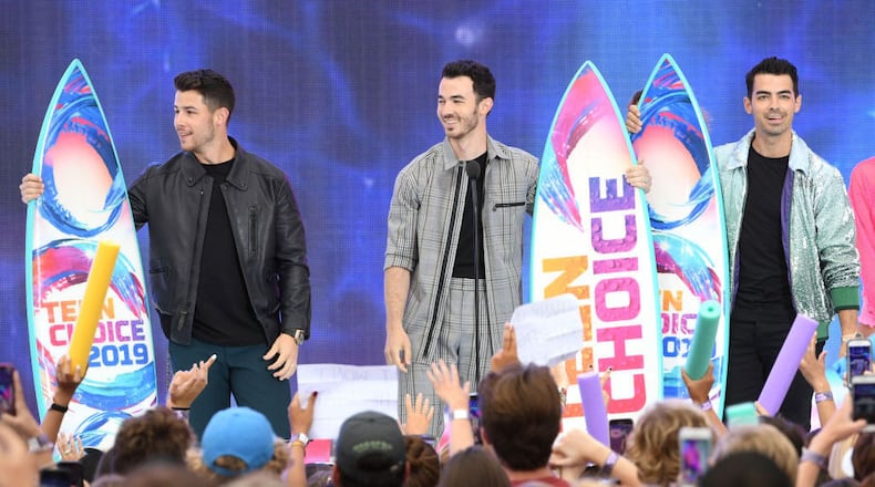 (L-R) Nick Jonas, Kevin Jonas and Joe Jonas of the Jonas Brothers accept the Teen Choice Decade Award onstage during FOX's Teen Choice Awards 2019 on August 11, 2019 in Hermosa Beach, California.
