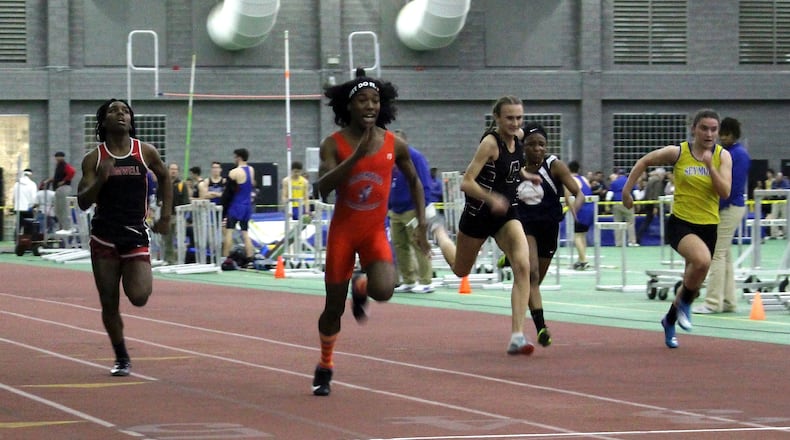 In this 2019 photo, Connecticut transgender athlete Terry Miller (second from left) runs a race with transgender athlete Andraya Yearwood (far left) and other high school runners in New Haven, Conn. Miller and Yearwood are among Connecticut transgender athletes who sparked a federal lawsuit filed last year by three athletes who felt it was unfair trans students could compete in girls’ sports. (AP Photo/Pat Eaton-Robb, File)