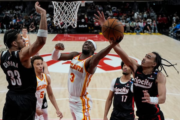 Hawks guard Caris LeVert (3) goes to the basket against the Portland Trail Blazers on April 1 in Atlanta. The Hawks currently have two first-round picks in next month’s NBA draft, one of which is a lower-level lottery pick.  (Mike Stewart/AP)