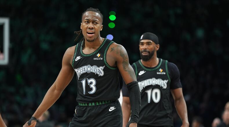 Minnesota Timberwolves guard Ayo Dosunmu (13) celebrates after making a 3-point basket during the second half of Game 4 of a first-round NBA basketball playoff series against the Denver Nuggets, Saturday, April 25, 2026, in Minneapolis. (AP Photo/Abbie Parr)