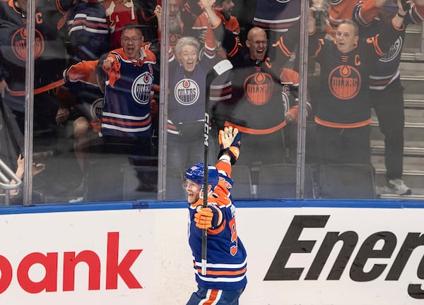 Edmonton Oilers' Corey Perry (90) celebrates a goal against the Florida Panthers during the third period in Game 2 of the NHL Stanley Cup final in Edmonton, Friday, June 6, 2025. (Jason Franson/The Canadian Press via AP)