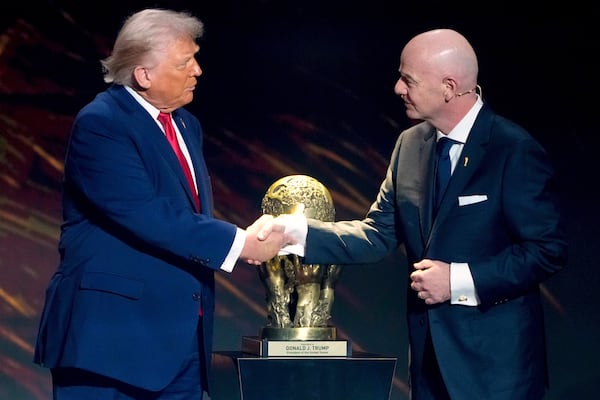 Two friends: FIFA President Gianni Infantino awards President Donald Trump with the newly invented FIFA Peace Prize in 2025. (Chris Carlson/AP)