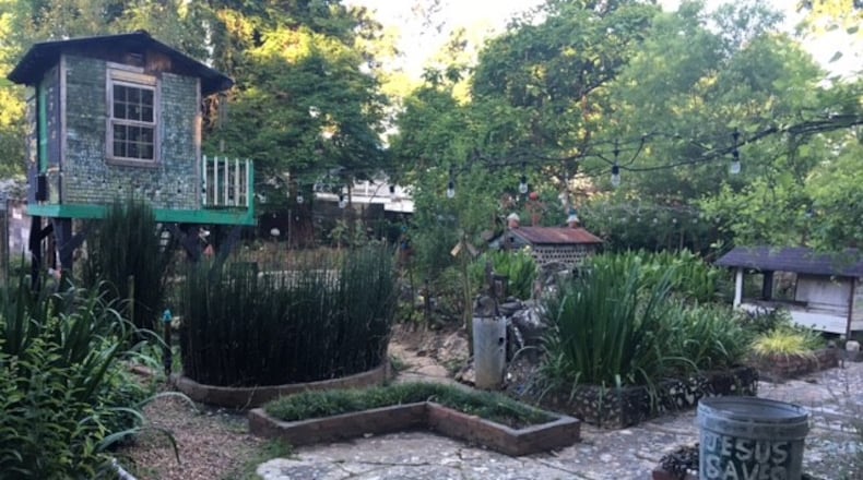 This corner of the four-acre Paradise Garden grounds created by folk artist Howard Finster features the shimmering Mirror House (top left). (BILL RANKIN/william.rankin@ajc.com)