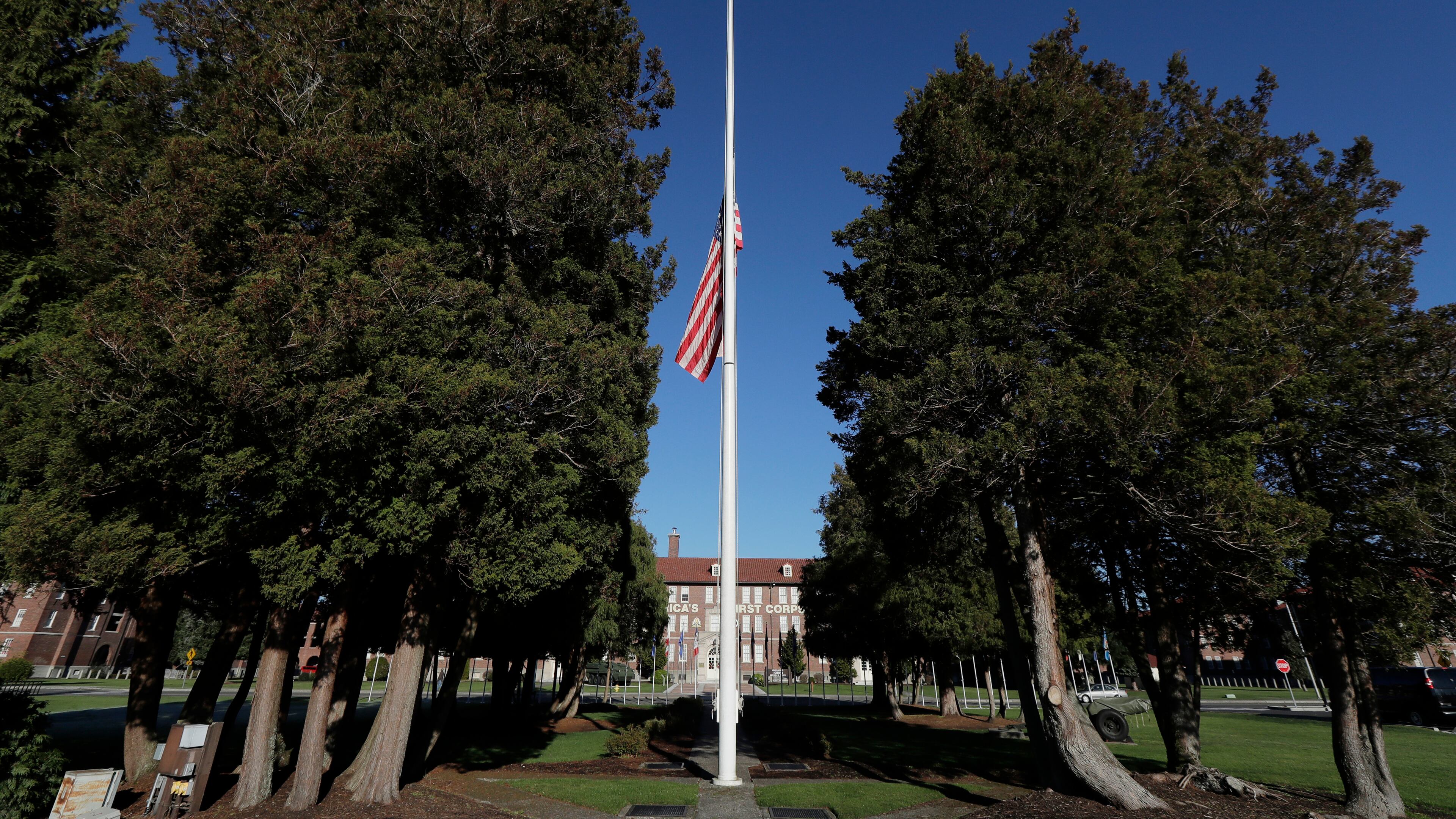 FILE - The main flag pole in front of the U.S. Army I Corps headquarters on Joint Base Lewis-McChord, south of Tacoma, Wash., hangs at half-staff, Wednesday, Dec. 5, 2018. (AP Photo/Ted S. Warren, File)
