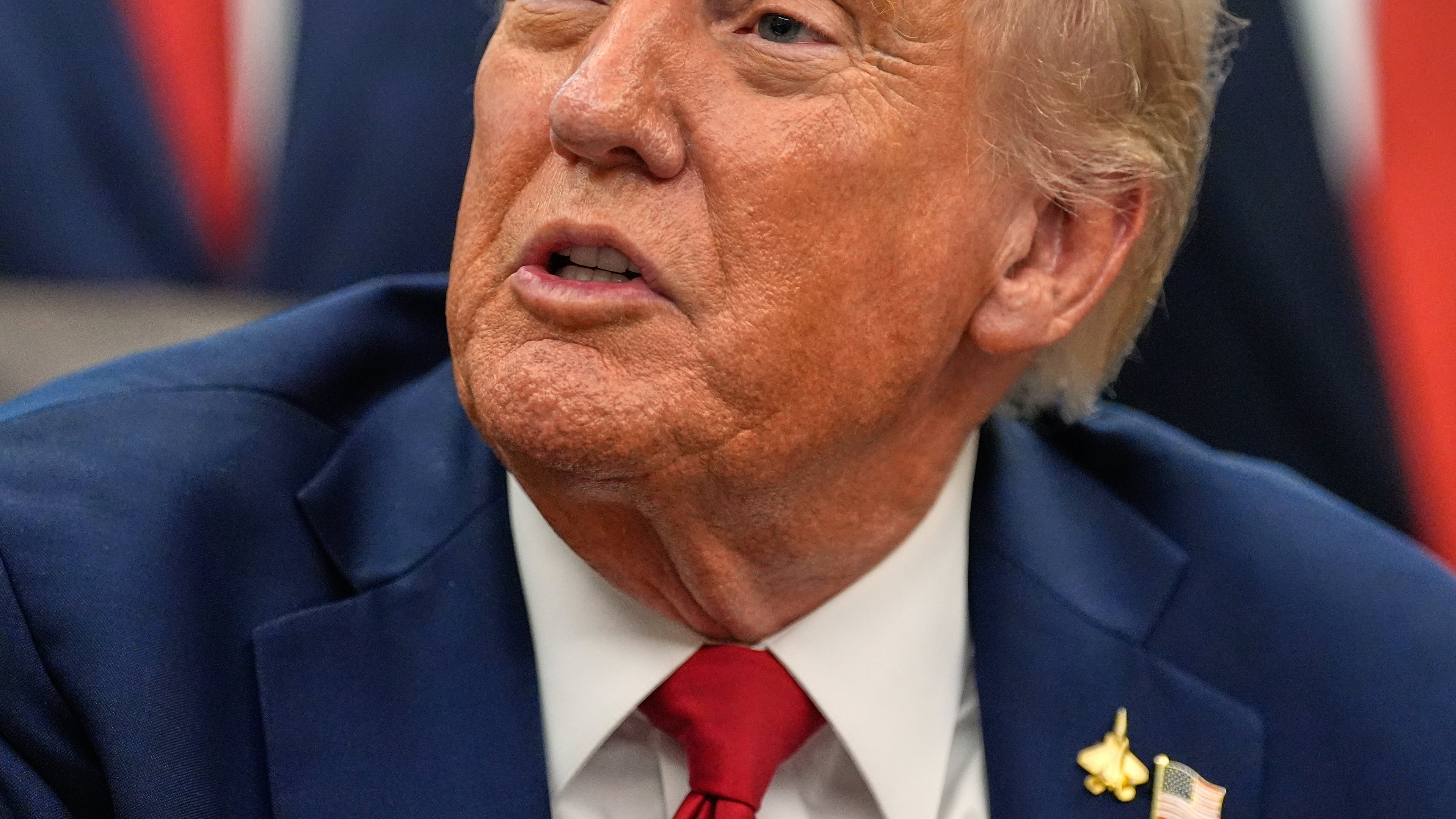 President Donald Trump speaks in the Oval Office of the White House before signing an executive order regarding childhood cancer and the use of AI, Tuesday, Sept. 30, 2025, in Washington. (AP Photo/Alex Brandon)