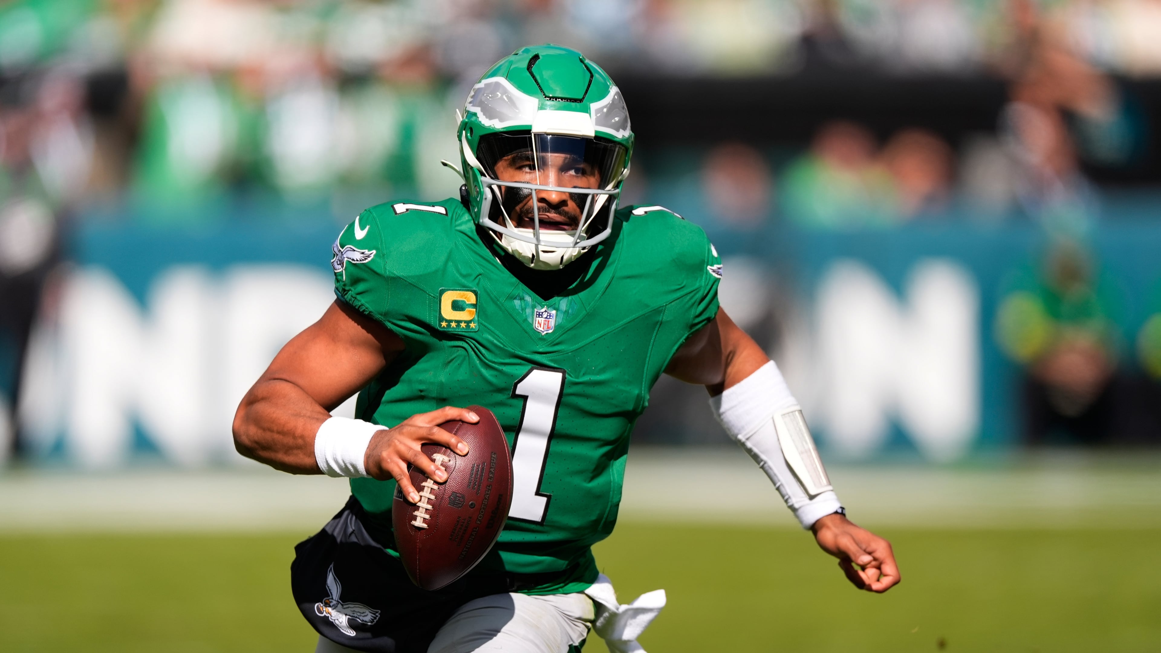 Philadelphia Eagles quarterback Jalen Hurts (1) runs with the ball during the first half of an NFL football game against the New York Giants on Sunday, Oct. 26, 2025, in Philadelphia. (AP Photo/Chris Szagola)