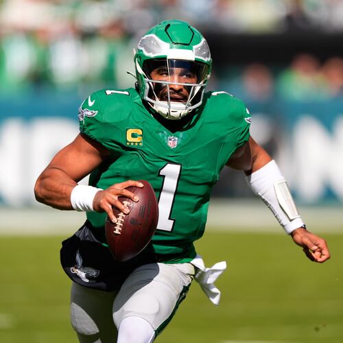Philadelphia Eagles quarterback Jalen Hurts (1) runs with the ball during the first half of an NFL football game against the New York Giants on Sunday, Oct. 26, 2025, in Philadelphia. (AP Photo/Chris Szagola)