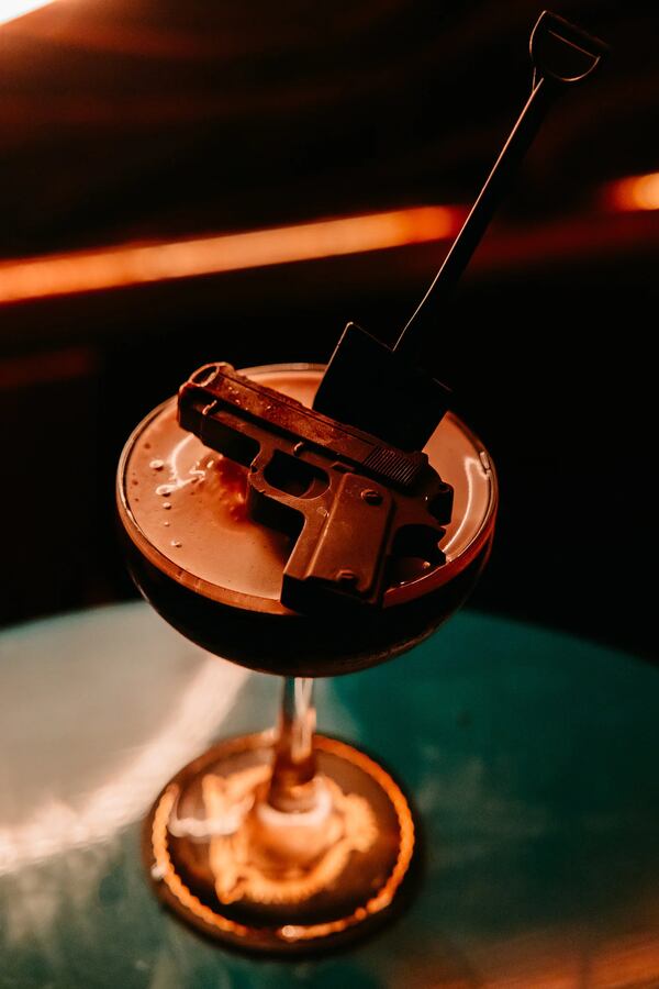 A Colombian bittersweet chocolate gun garnishes the Good Shot cocktail, part of a "GoodFellas" themed omakase at Tiger Sun. The shovel is not edible but can be used to scoop up the affogato-style drink. (Courtesy o Luke Beard)