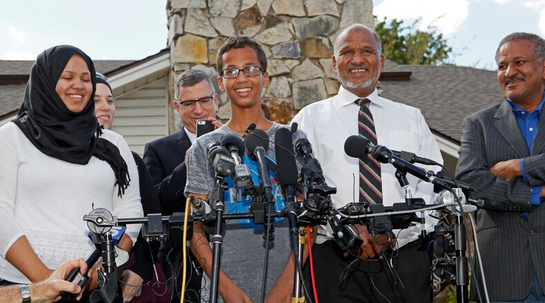 IRVING, TX - SEPTEMBER 16: 14-year-old Ahmed Ahmed Mohamed, surrounded by his family, speaks during a news conference on September 16, 2015 in Irving, Texas. Mohammed was detained after a high school teacher falsely concluded that a homemade clock he brought to class might be a bomb. The news converence, held outside the Mohammed family home, was hosted by the North Texas Chapter of the Council on American-Islamic Relations. (Photo by Ben Torres/Getty Images)