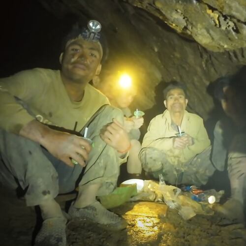This image made from the video provided by Benz Norrased Palasing Seascout Diving shows rescuers speaking to the villagers who were trapped and found in a flooded cave in Xaisomboun province, Laos, Wednesday, May 27, 2026. (Benz Norrased Palasing Seascout Diving via AP)