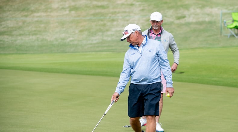 Scott Parel helps his pro-am partner line up a putt at the Mitsubishi Electric Classic, April 24, 2024, at TPC Sugarloaf in Duluth.