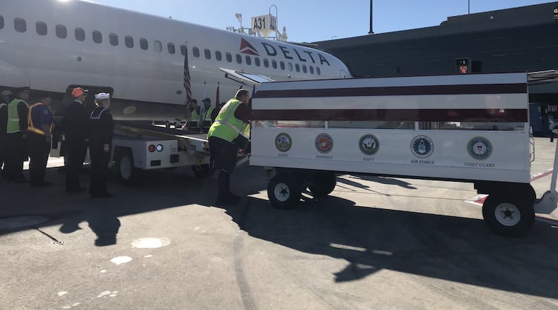 Delta Honor Guard honors the remains of John William Craig.