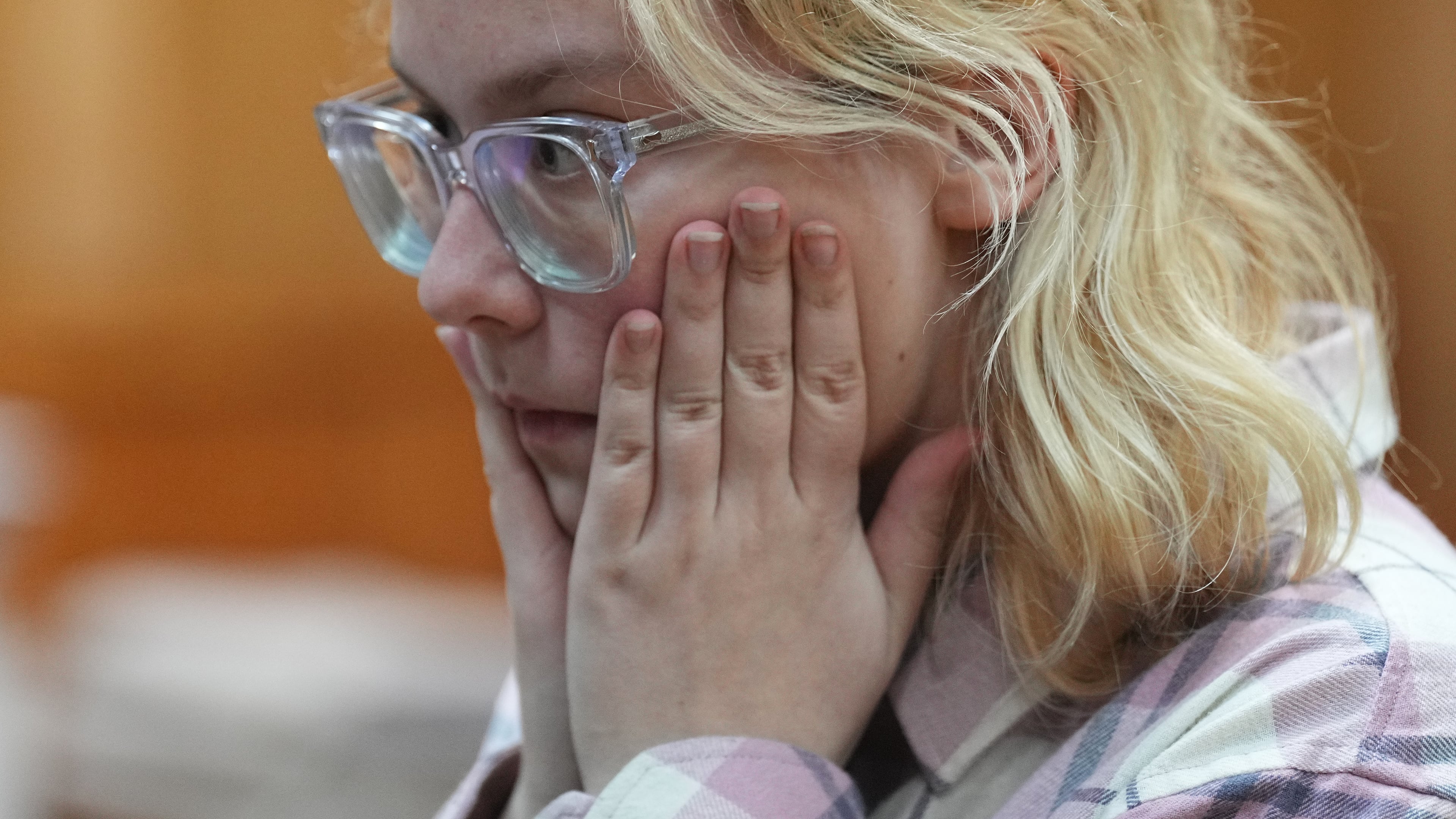 Diana Loginova, an 18-year-old Russian singer of Stoptime street band who served two consecutive 13-day prison sentences on various misdemeanor charges, sits during a court session in St. Petersburg, Russia, Tuesday, Nov. 11, 2025. (AP Photo/Dmitri Lovetsky