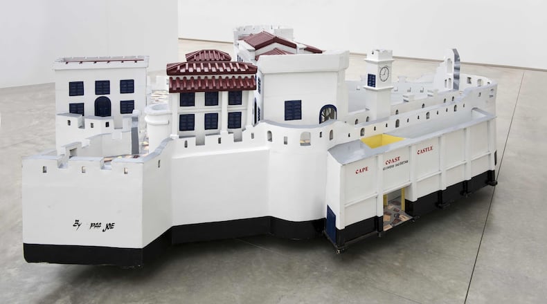 A sculpture by Ghanaian fantasy coffin maker Paa Joe. This is a replica of Cape Coast Castle where thousands of enslaved Africans were held before they were shipped off to the Americas and the Caribbean in the transatlantic slave trade. The replica is part of the High Museum’s new exhibition “Paa Joe: Gates of No Return.” The show was originally done by the American Folk Art Museum in 2018. Photo courtesy of Paa Joe and Jack Shainman Gallery