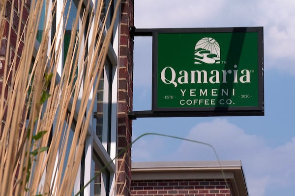 In this image made from video, a sign welcomes patrons to the Qamaria Yemeni Coffee Co. Monday, June 9, 2025, in Dearborn, Mich. (AP Photo/Mike Householder)