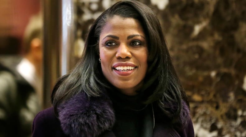 In this Dec. 13, 2016 file photo, Omarosa Manigault smiles at reporters as she walks through the lobby of Trump Tower in New York. Manigault Newman is following up her year in the White House with a stint on "Celebrity Big Brother." CBS unveiled the cast of the reality show's upcoming season Sunday with a commercial that aired during the Grammy Awards.
Besides Manigault Newman, other contestants include basketball star Metta World Peace and actresses Marissa Jaret Winokur and Keshia Knight Pulliam. (AP Photo/Seth Wenig)