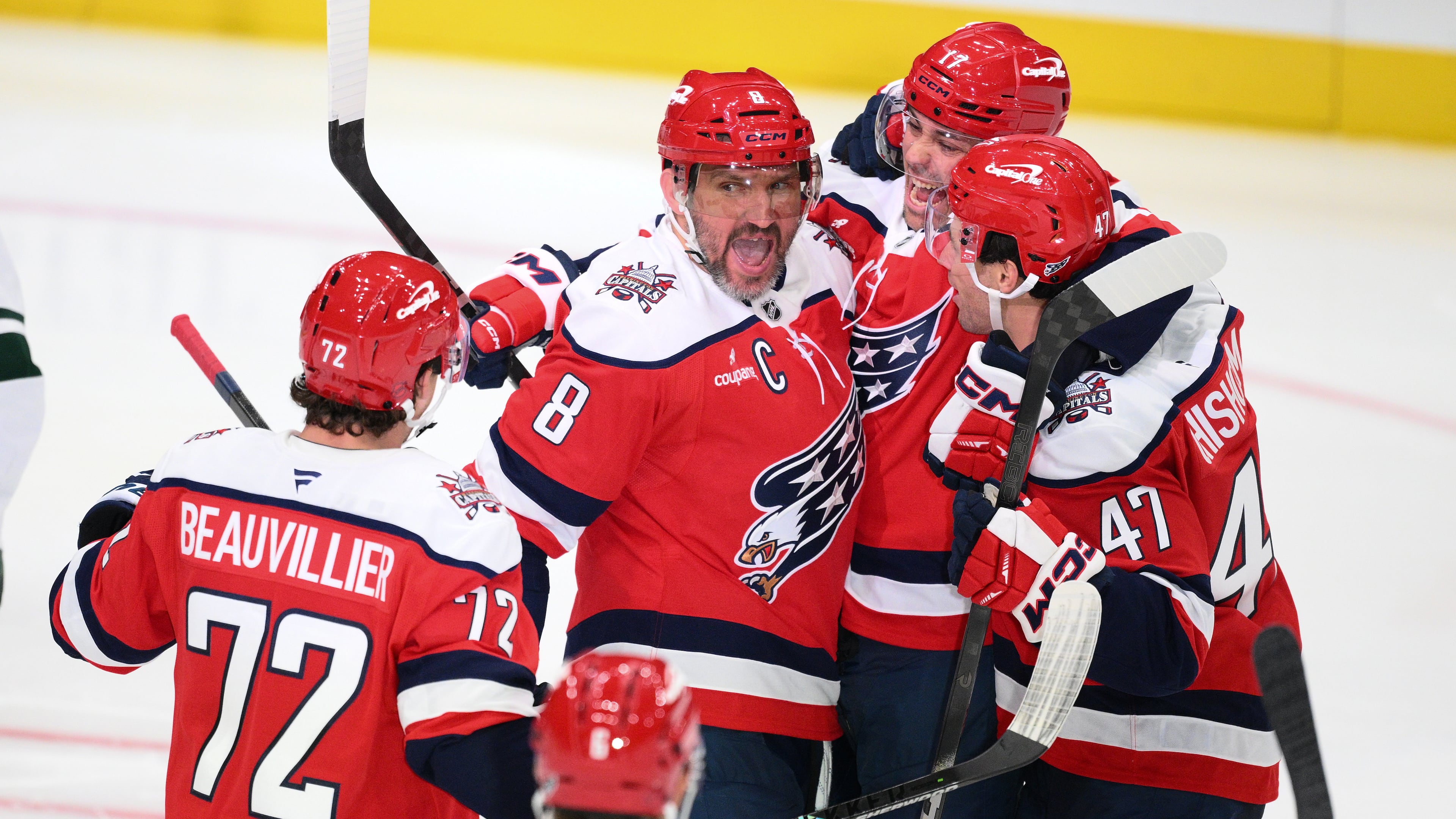Washington Capitals left wing Alex Ovechkin (8) celebrates his goal with teammates during the third period of an NHL hockey game against the Minnesota Wild, Friday, Oct. 17, 2025, in Washington. (AP Photo/Nick Wass)