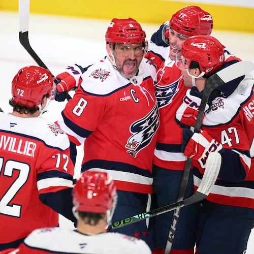 Washington Capitals left wing Alex Ovechkin (8) celebrates his goal with teammates during the third period of an NHL hockey game against the Minnesota Wild, Friday, Oct. 17, 2025, in Washington. (AP Photo/Nick Wass)