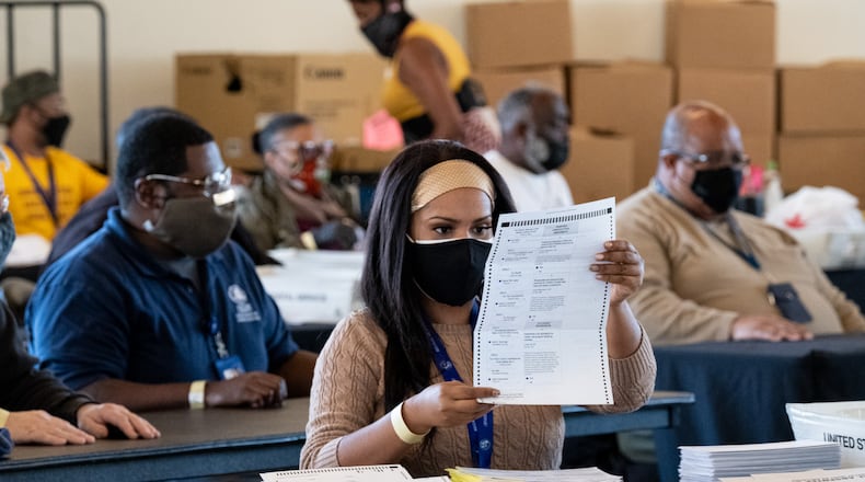 201104-Atlanta-Fulton County elections workers sort absentee ballots at State Farm Arena on Wednesday afternoon, Nov. 4, 2020. Ben Gray for the Atlanta Journal-Constitution