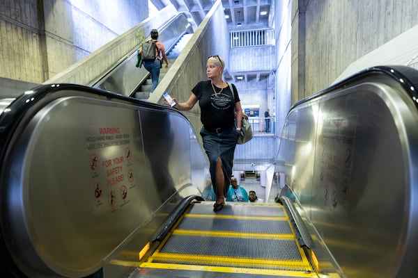 Lurelia Freeman rides an escalator at a MARTA station in Atlanta for her commute from work on Tuesday, Sept. 30, 2025. (Arvin Temkar/AJC)