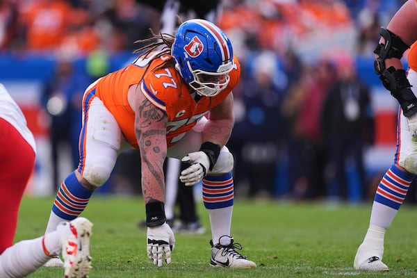 FILE - Denver Broncos guard Quinn Meinerz (77) gets set in the first half of an NFL football game Sunday, Jan. 5, 2025, in Denver. (AP Photo/David Zalubowski, File)