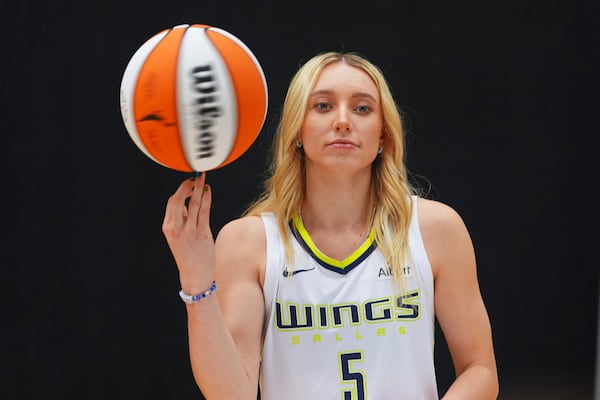 Dallas Wings guard Paige Bueckers poses for photos during a WNBA basketball media day in Arlington, Texas, Wednesday, May 7, 2025. (AP Photo/LM Otero)